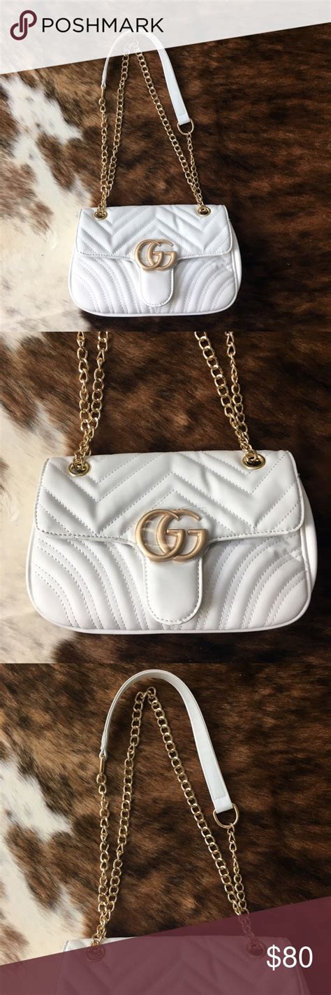 white gucci purse with gold chain